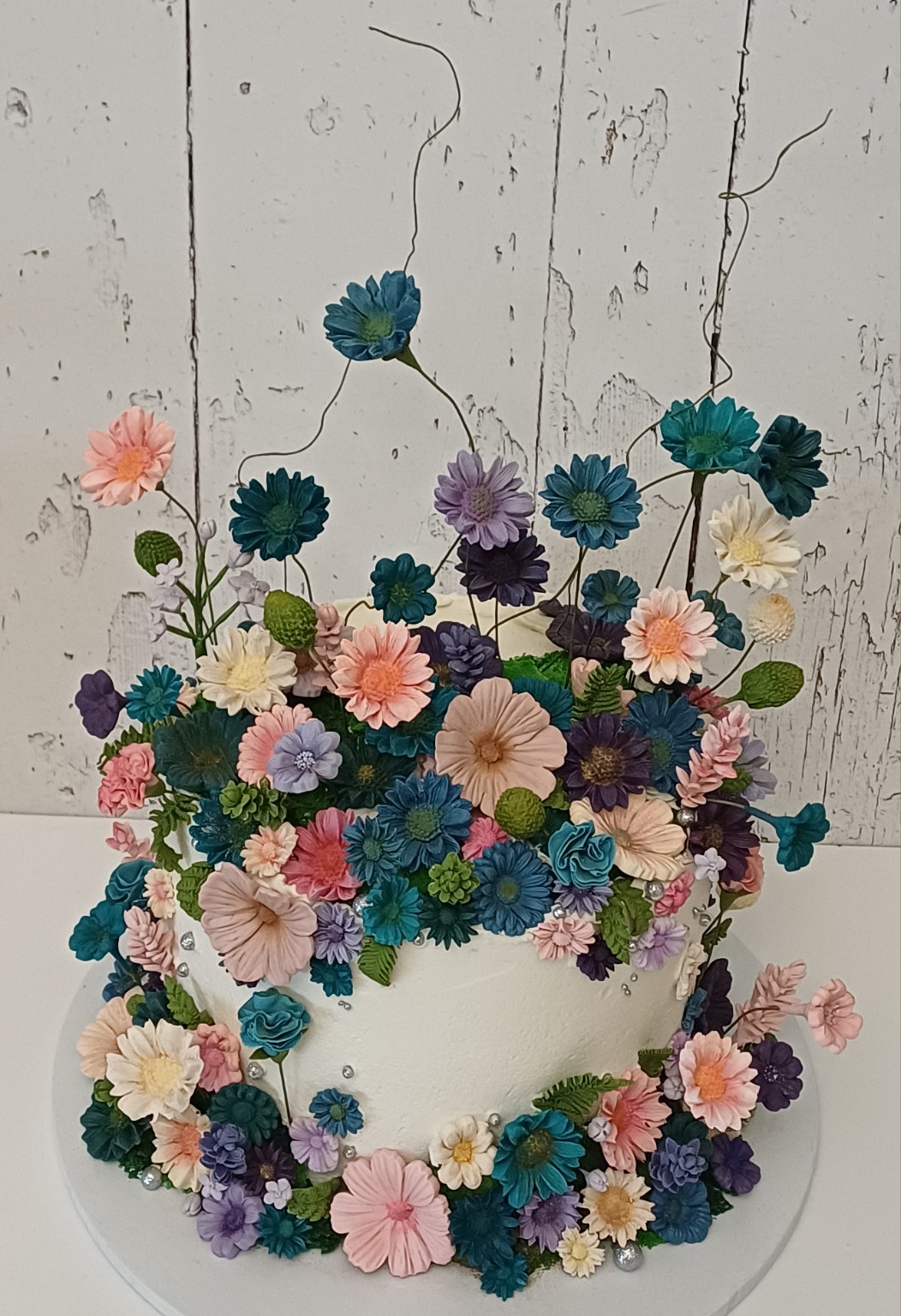 Soeterie floral tiered cake with colourful flowers